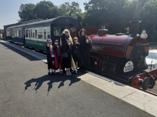 Young Witches and Wizards board the Hogsweed Express